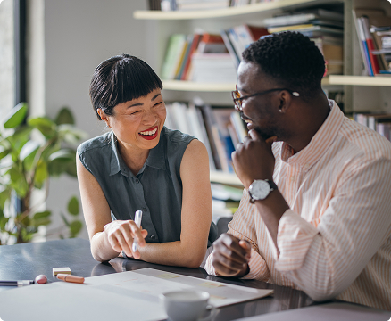 Woman and man talking at desk