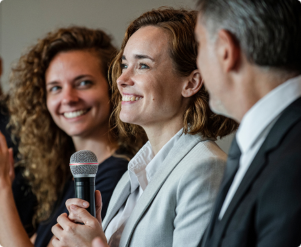 Woman smiling holding microphone