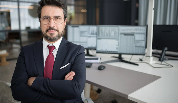 Business man sitting with arms crossed